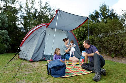 Family picnic outside tent
