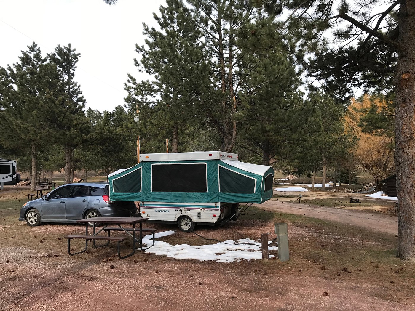 Car and pop up camper at Larsson’s Crooked Creek