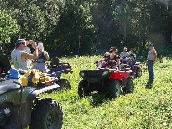 Group of people riding ATVs