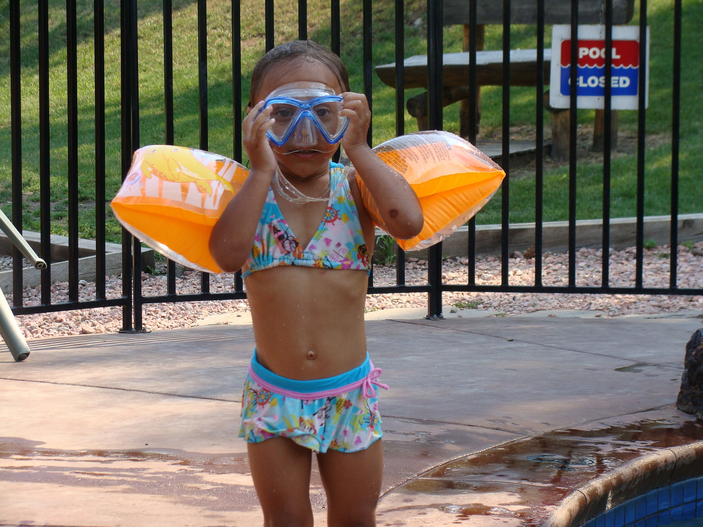 Little girl in floaties